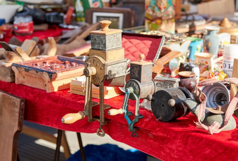 vintage items on a table with a red tablecloth