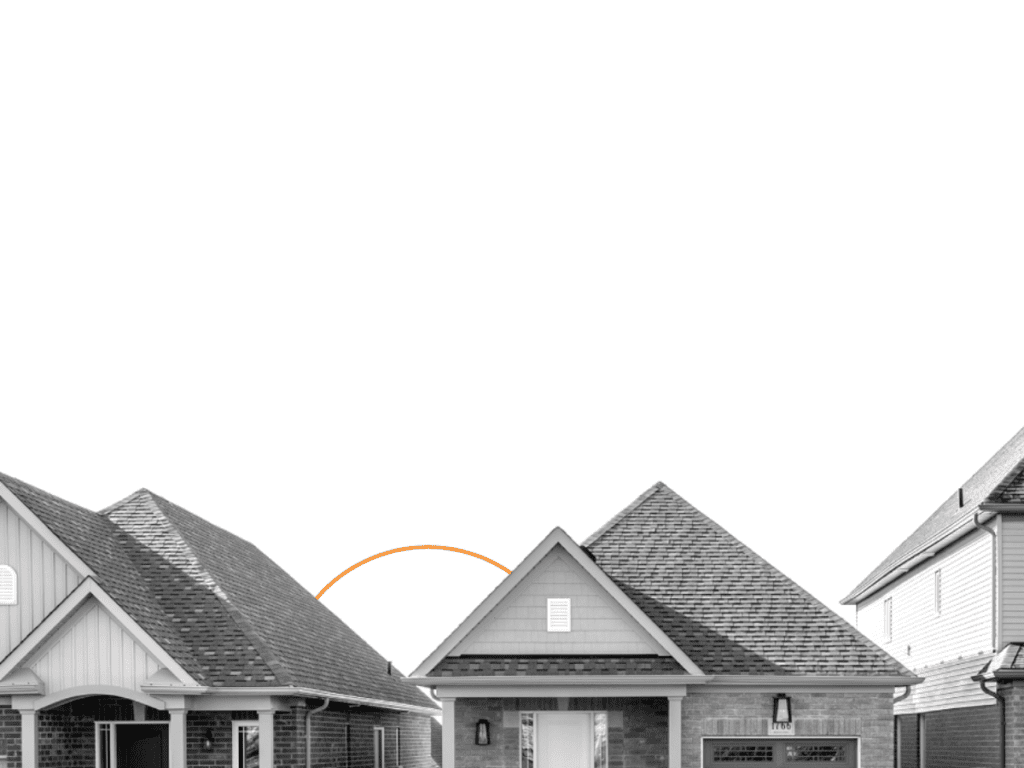 Tops of 3 modest brick houses in a row, greyscale